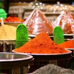 Colorful assortment of spices in Gaziantep market, featuring various chili powders and seasonings.